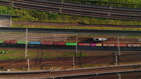 rail container tracking over railway station in barendrecht, netherlands. aerial drone shot