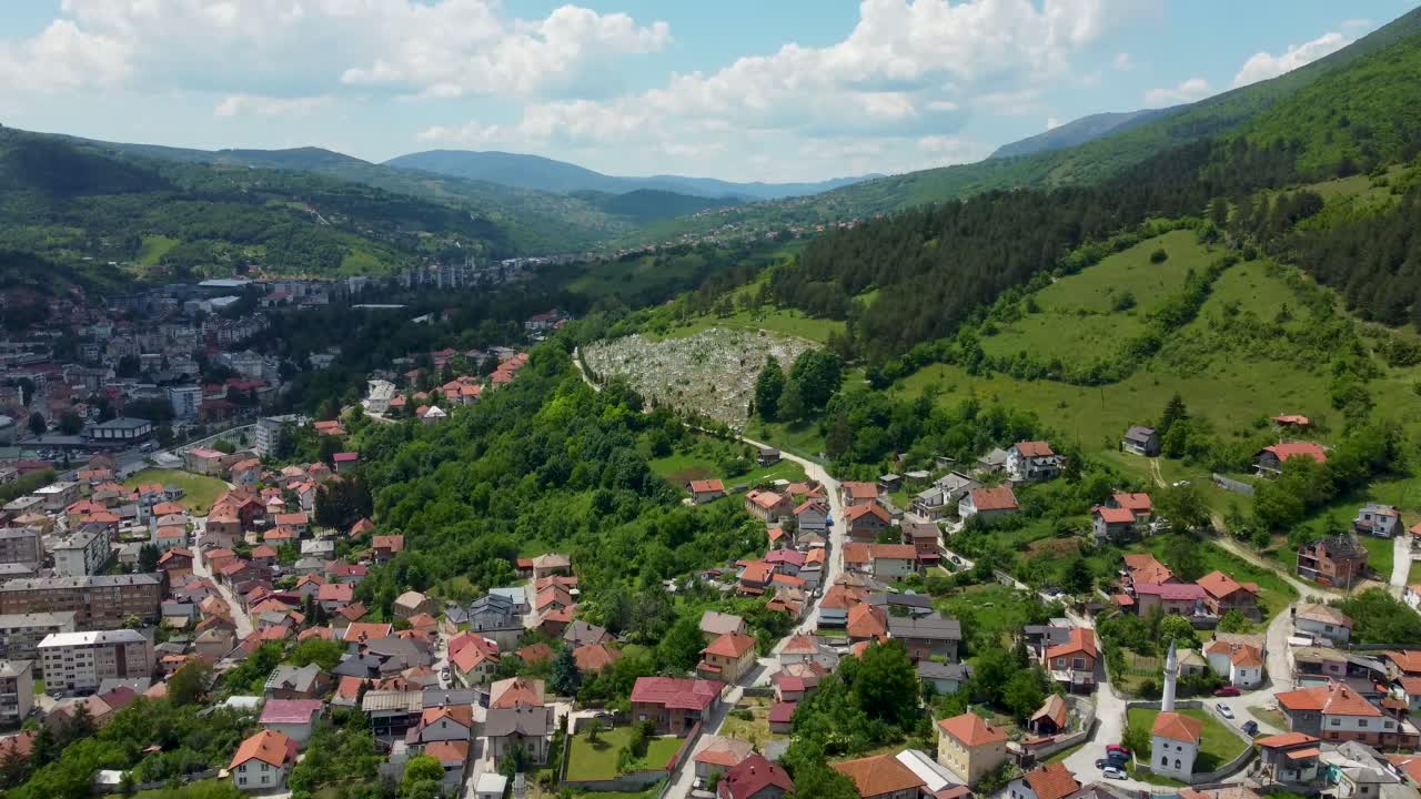 Drone footage of Travnik, Bosnia and Herzegovina, capturing the historic Old Town, Stari Grad fortress, and the surrounding mountain landscape