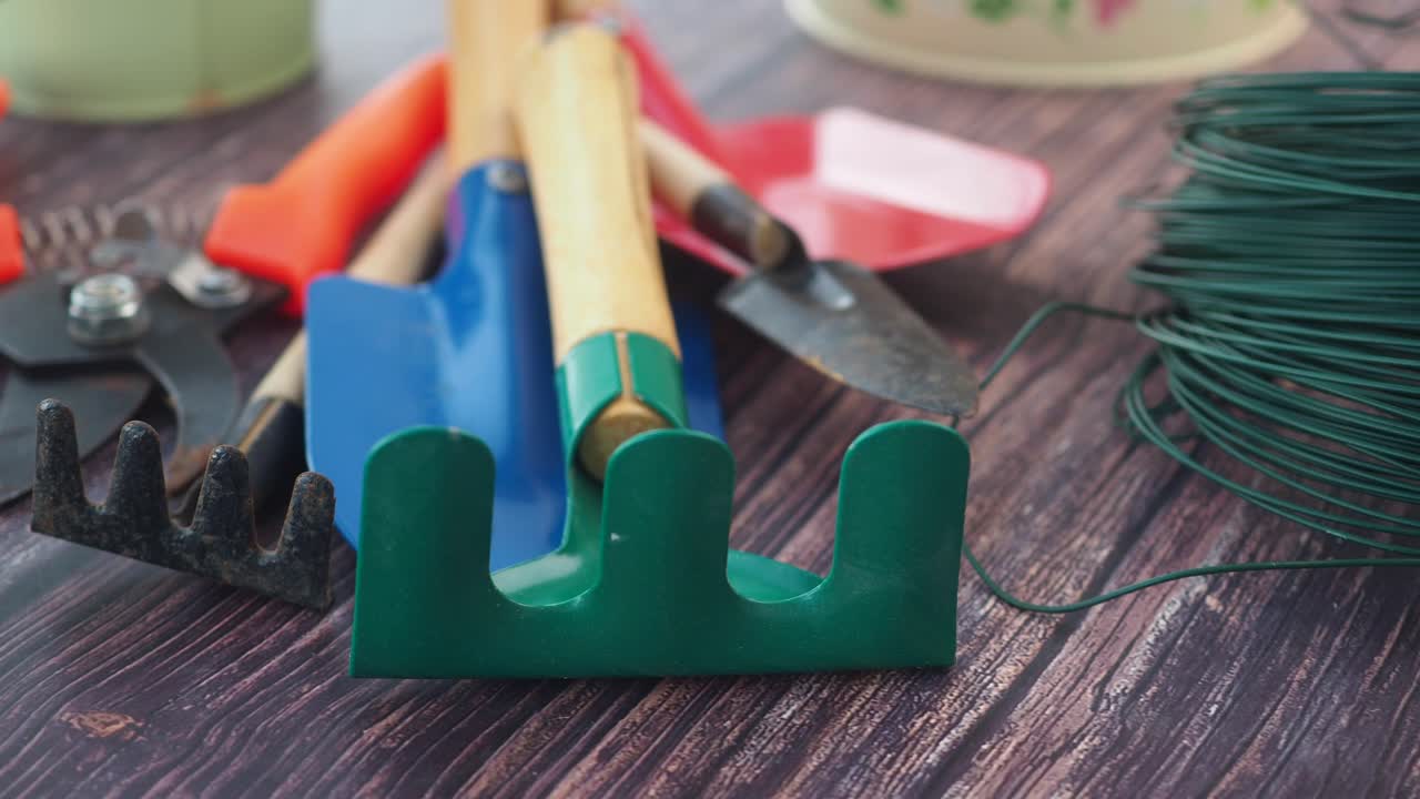 Various Gardening Tools on a Wooden Surface