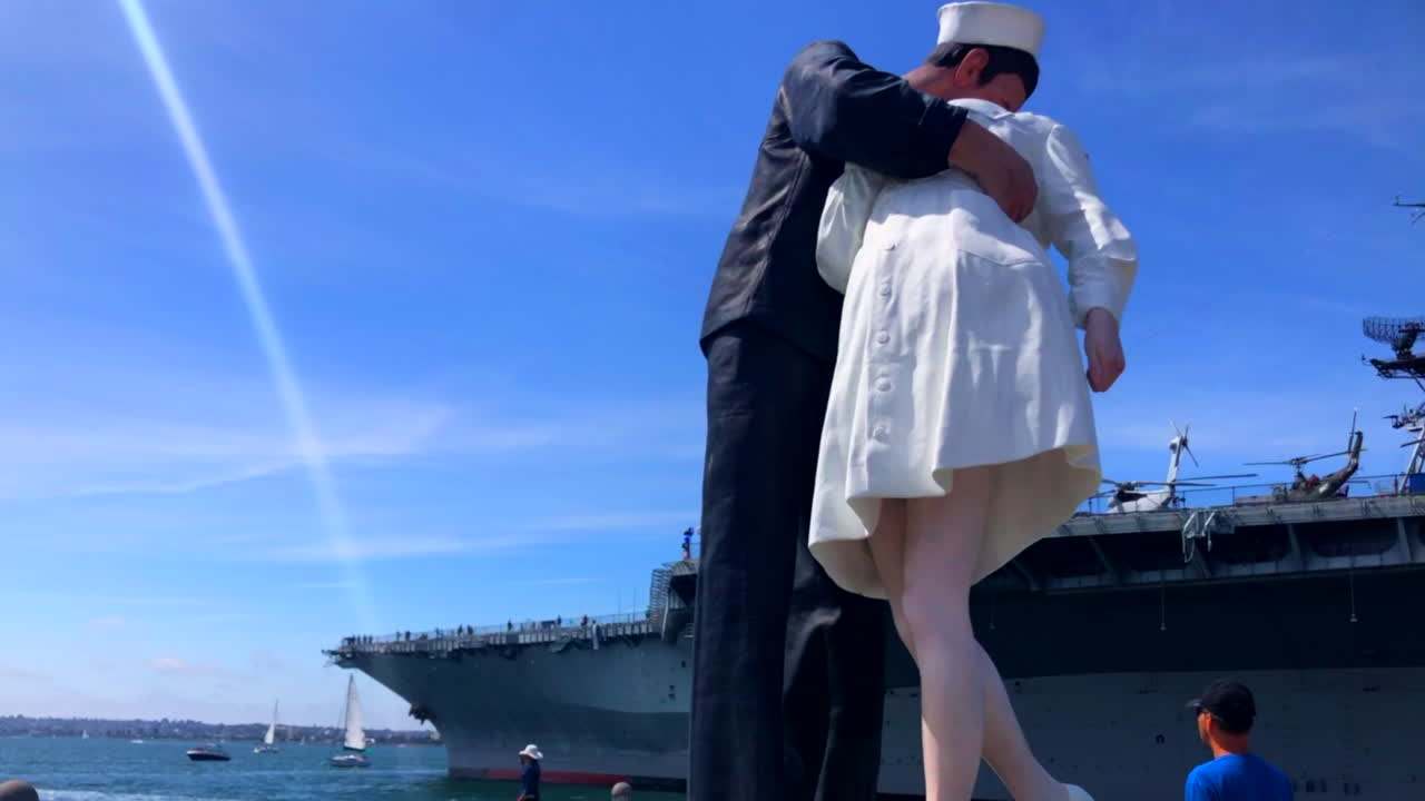 Slow motion - Majestic view of the Uncoditional Surrender statue in San Diego.