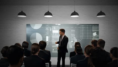 businessman presenting graphs to colleagues