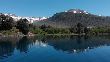 aerial - snowcapped mountain next to hermoso lake, neuquen, argentina, truck right