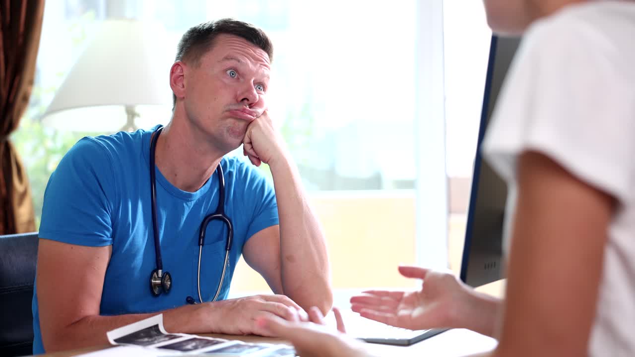 Bored Doctor in Consultation