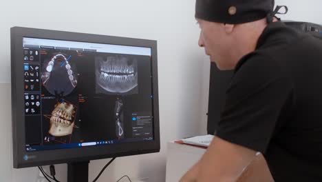 dentist reviewing dental x-rays