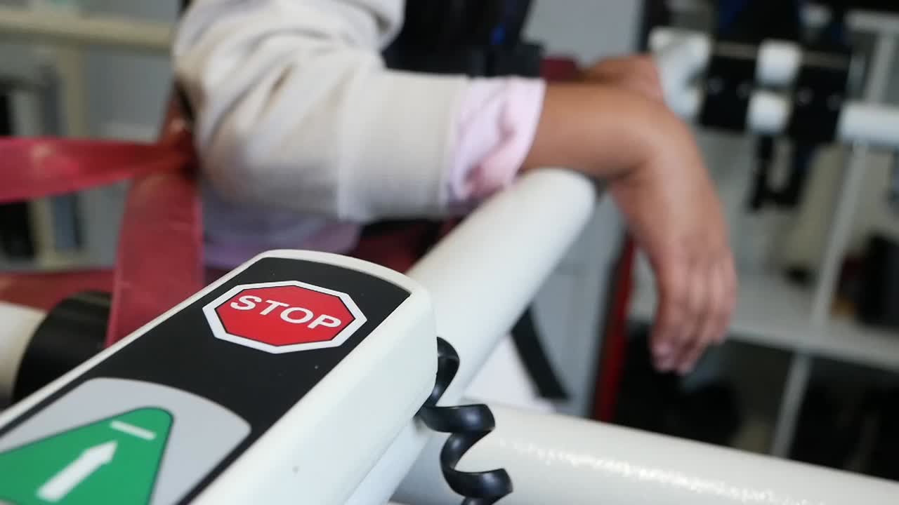 Patient Using Mobility Aid with Stop Button