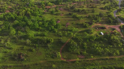 An-early-morning-drone-flight-revealing-Enchanted-Rock-and-the-Texas-Hill-Country-scenic-landscape