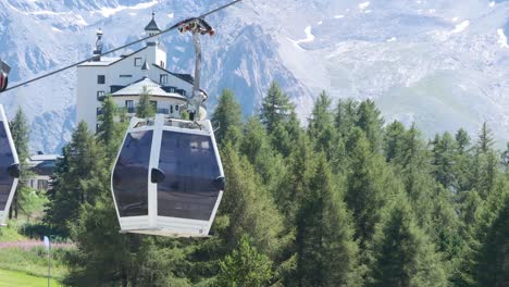 cable car moving over trees and mountains