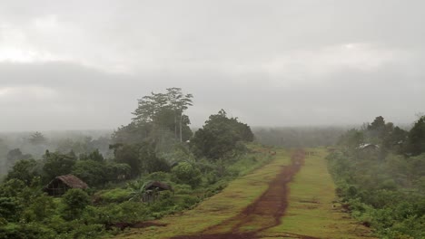 fog rolling through a landing strip in the jingle - wide shot