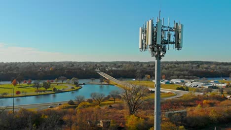 5g cell tower for telecommunications. aerial rising view