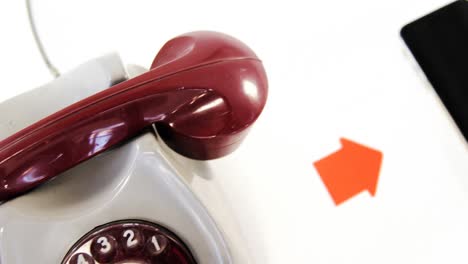 Close-up-of-old-telephone-and-smartphone