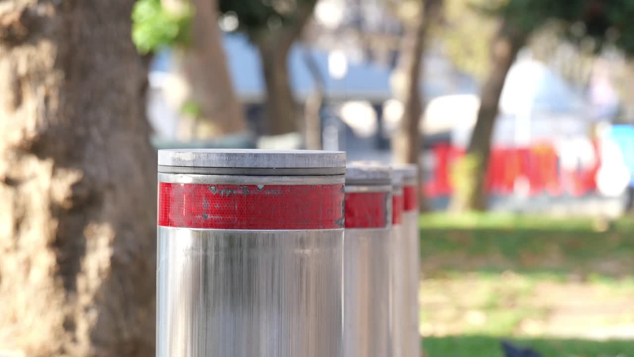 Row of Reflective Bollards with Lights in an Urban Park