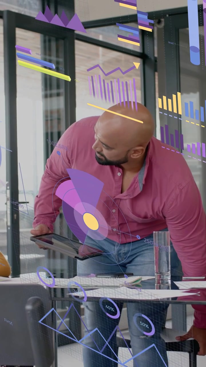 Vertical video: Man entering office with tablet, reviewing slides while charts reacting to tablet