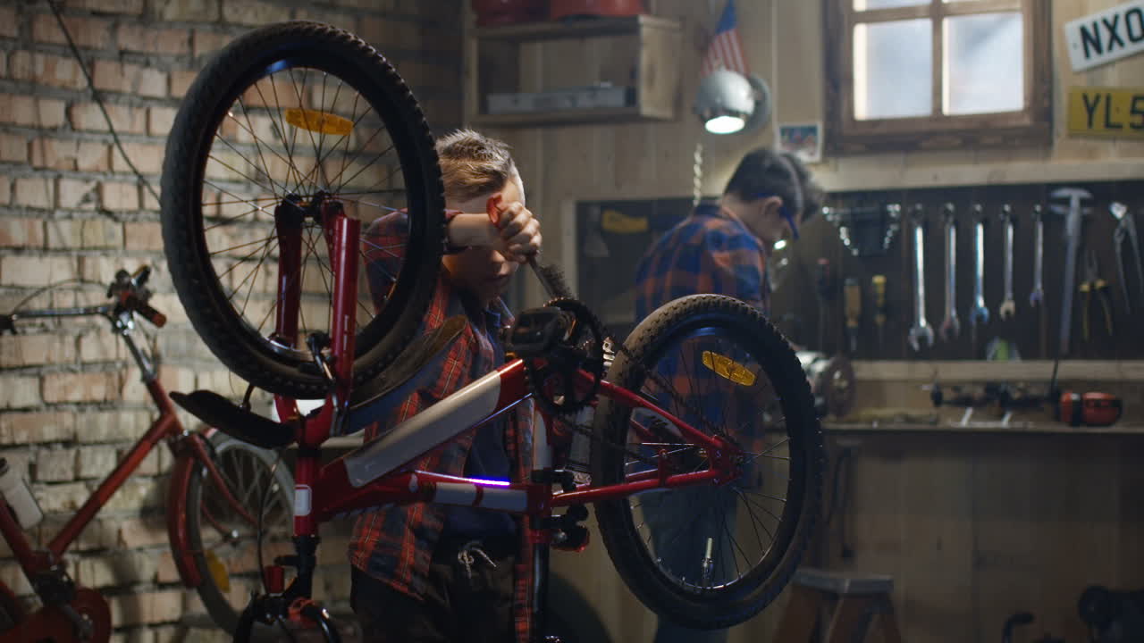 Boys Repairing Bicycles in a Garage