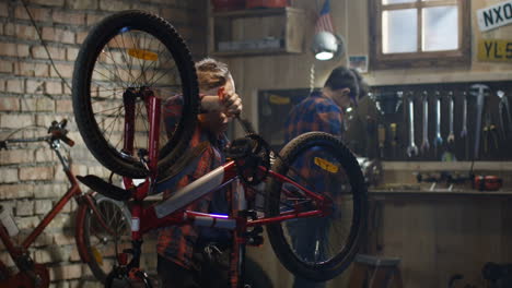 boys repairing bicycles in a garage