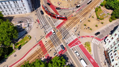 cars, trams and people go by the roads in the city. large crossroads in the cityscape of bratislava, slovakia. top view