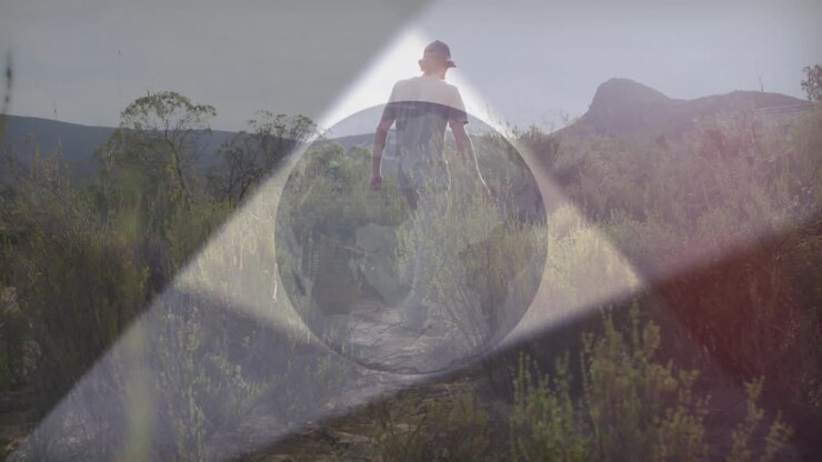 man walking desert path, showcasing technology journey with animated data nodes and lens flares