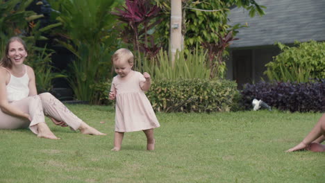 toddler walking and falling in garden