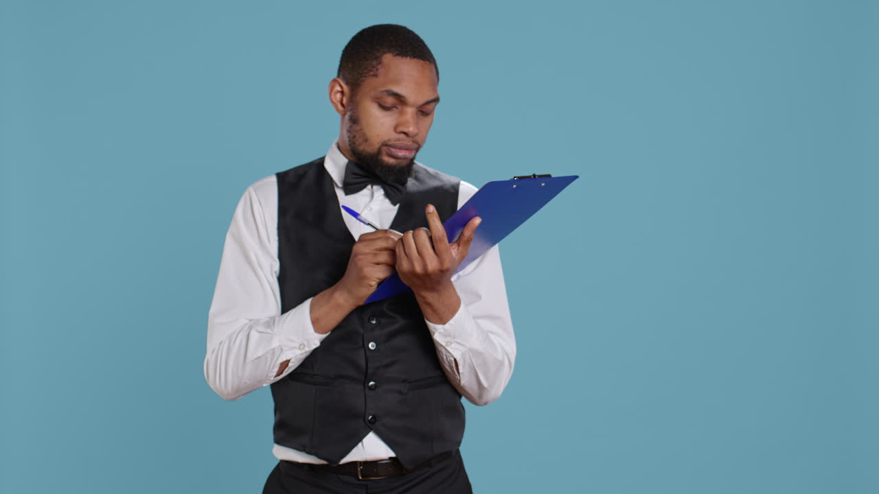 Receptionist worker writing down notes on clipboard files