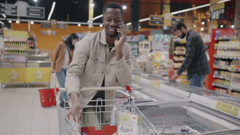 man shopping at supermarket