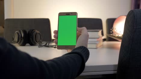 green screen man watching on his mobile phone