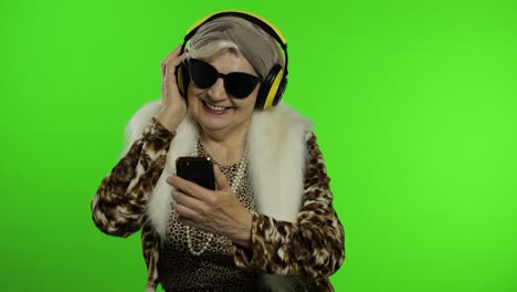 Elderly-caucasian-grandmother-woman.-Dance,-celebrate,-listen-music.-Chroma-key