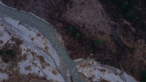 Creek-and-mountain-with-pine-tree-forest-tilt-and-approach