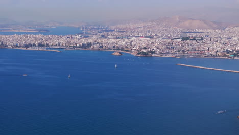 aerial slider shot over the aegean sea and athens city