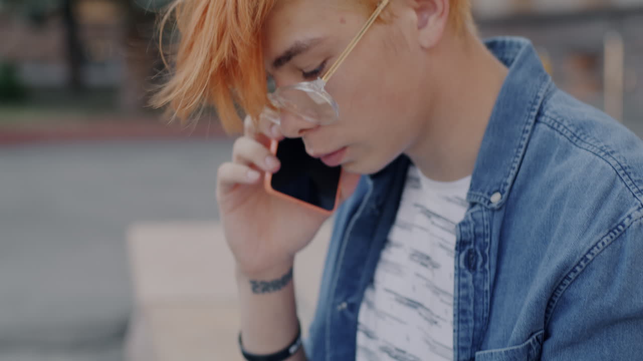 Young Person Using Laptop and Smartphone Outdoors