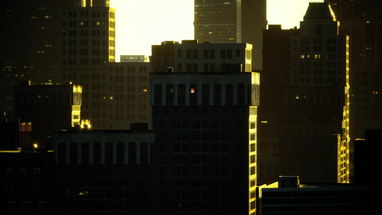 City skyline illuminated by sunset with warm glow reflecting off buildings