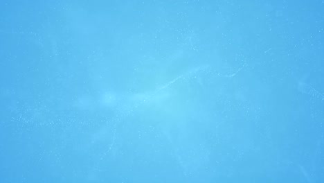 las partículas onduladas suaves de fondo son un video de stock de bucle sin costuras.