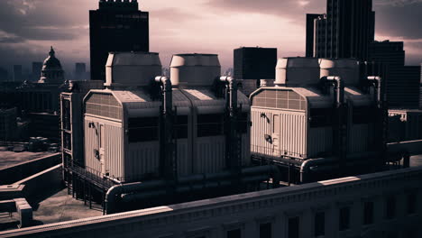 cooling towers on a city rooftop