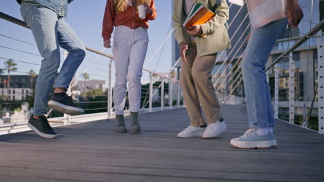 group of people jumping on a bridge