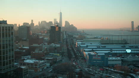 new york skyline, chelsea piers, hudson river with one world observatory in nyc