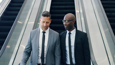 smiling diverse businessmen on escalator standing