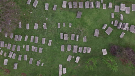 top view of cemetery of old medieval tombstone - stecak