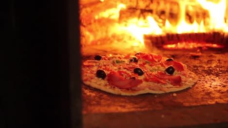 wood is burning in a pizza oven