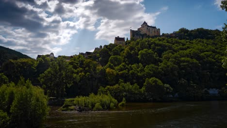 timelapse of the magnificent castle of castelnaud above the dordogne river. with clouds that announce a storm, dordogne, france