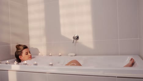 woman taking bath in bathtub