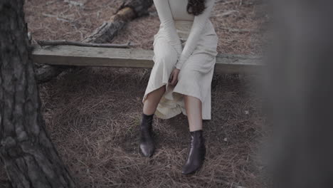 fashionable spanish woman in long dress in boots