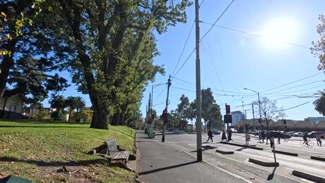 people crossing street near park in melbourne