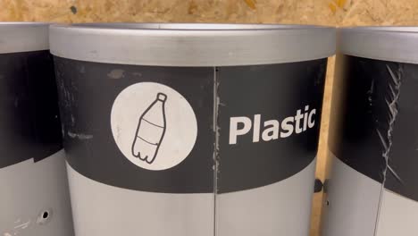 in the trash can where people can dispose of their rubbish, the term plastic is written in white