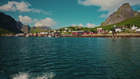 Boat tour around the fjords in Reine. Lofoten islands, Norway.
View of the Norwegian sea and the picturesque green mountainous landscape.