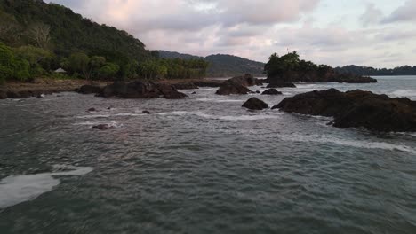 Drone-shot-flying-low-over-the-sea-and-rocks-on-the-coast-of-Costa-Rica