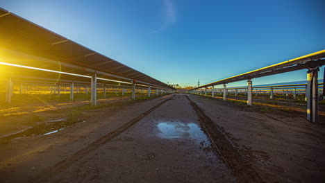 time-lapse of contemporary photovoltaic panel system tracking the sun, sunset