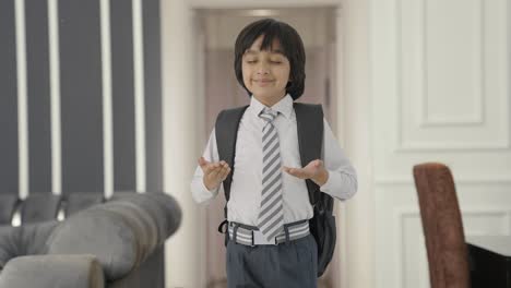 happy indian school boy doing breathe in breathe out exercise