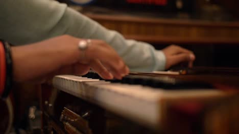 man playing the harmonium