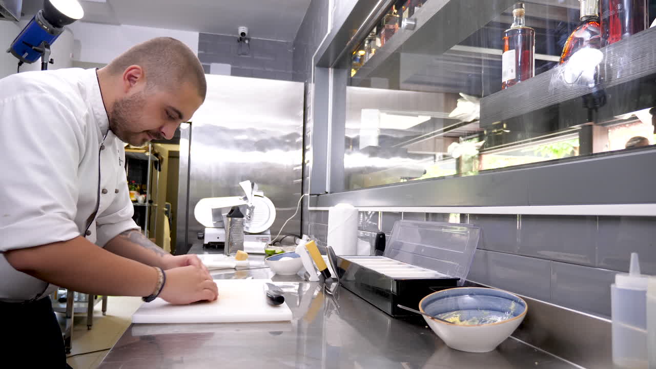 Chef preparing meat in a commercial kitchen