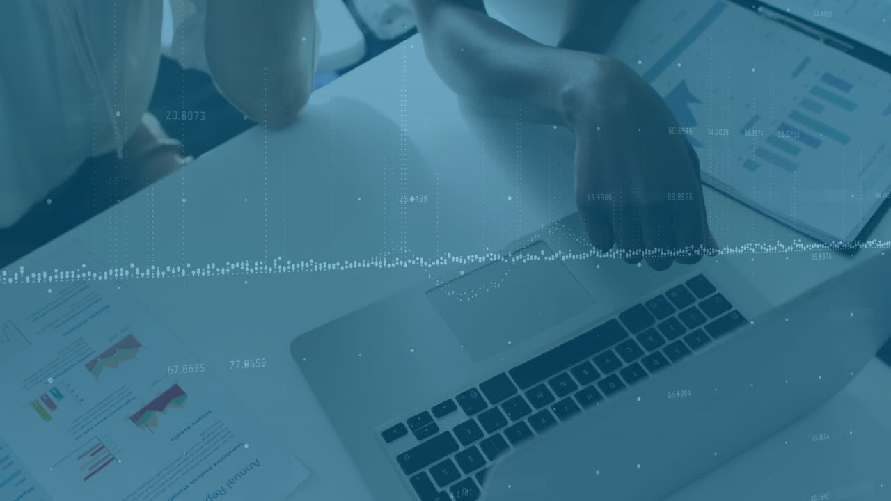 Hands working on laptop with data charts and graphs overlay animation