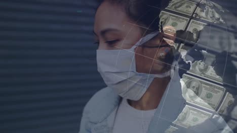 digital composite video of globe made of american dollar bills against woman wearing face mask