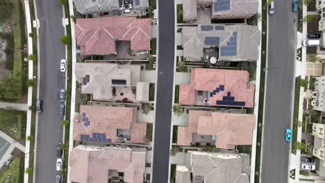 aerial birdseye, tustin houses with solar panels on roof, community in residential neighborhood, renewable energy